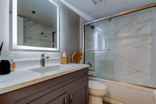 7432 Sunshine Skyway Ln S Unit 206, Saint Petersburg, FL 33711 - full bathroom with toilet, vanity, and enclosed tub / shower combo