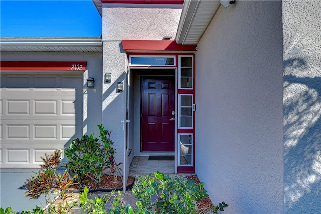 doorway to property featuring a garage