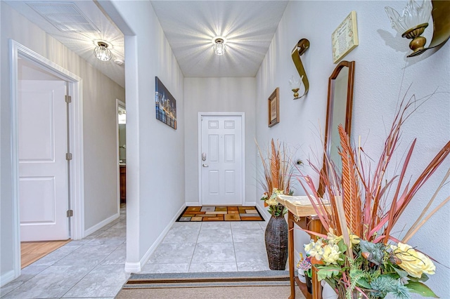 interior space with light tile patterned floors