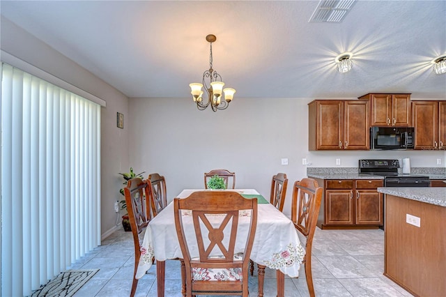 tiled dining area featuring a notable chandelier