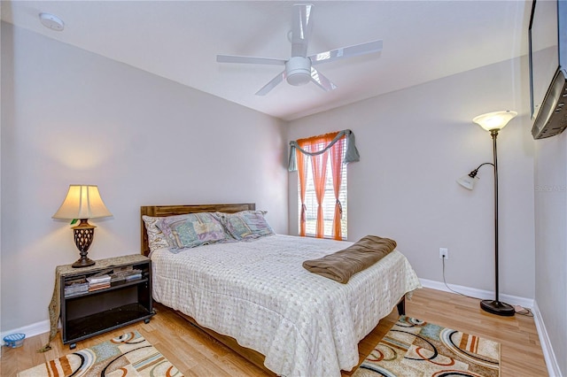 bedroom featuring ceiling fan and light wood-type flooring