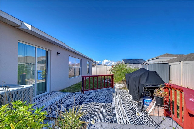 wooden deck featuring central AC