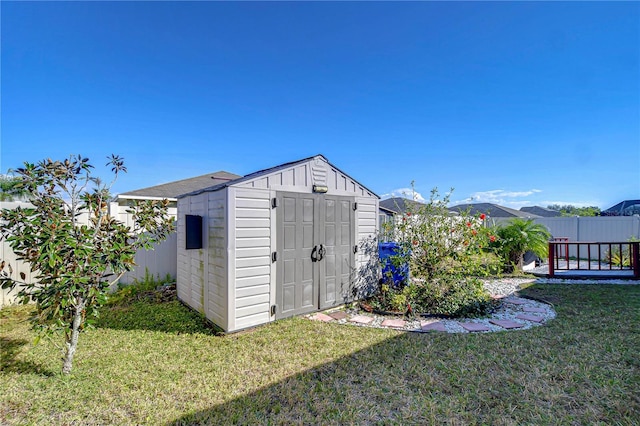 view of outbuilding with a yard