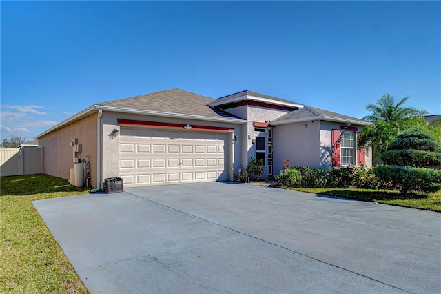 view of front facade with a garage and a front lawn