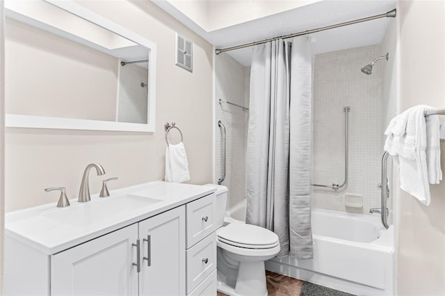 bathroom with vanity, toilet, visible vents, and shower / tub combo with curtain