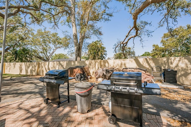 view of patio featuring area for grilling and a fenced backyard