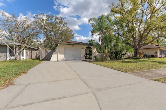 view of front of property featuring a garage and a front yard