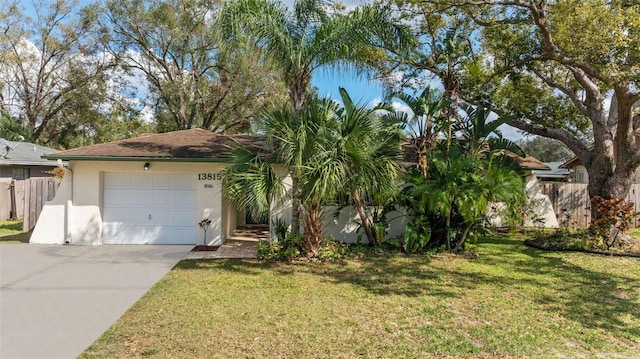 view of front of house featuring a garage and a front yard