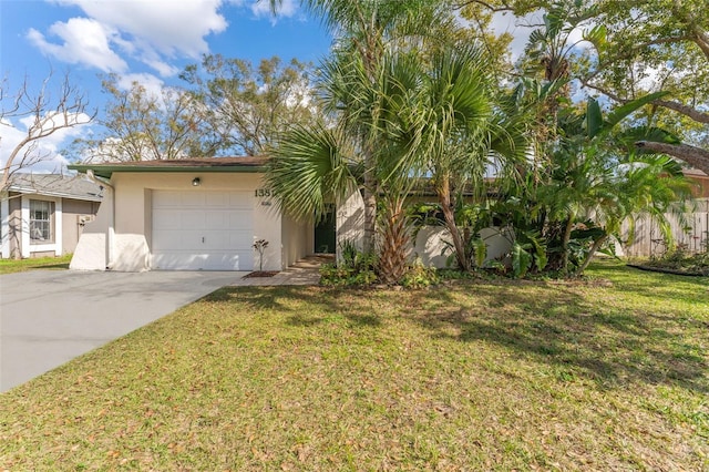 view of front of property with a garage and a front lawn