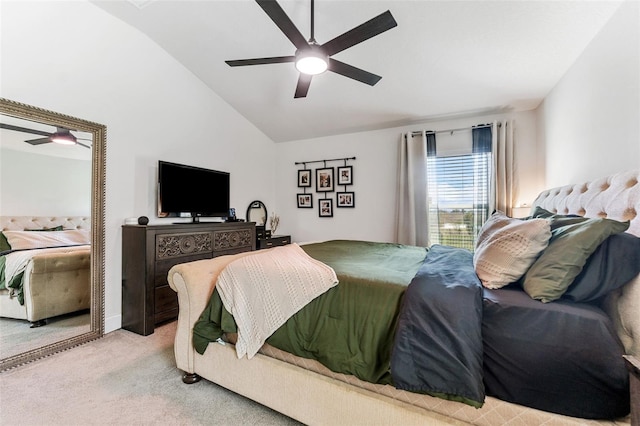 bedroom featuring ceiling fan, lofted ceiling, and light carpet