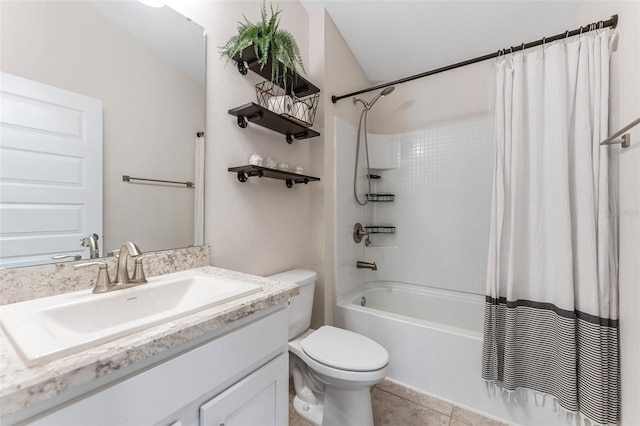 full bathroom featuring vanity, tile patterned flooring, toilet, and shower / bath combo