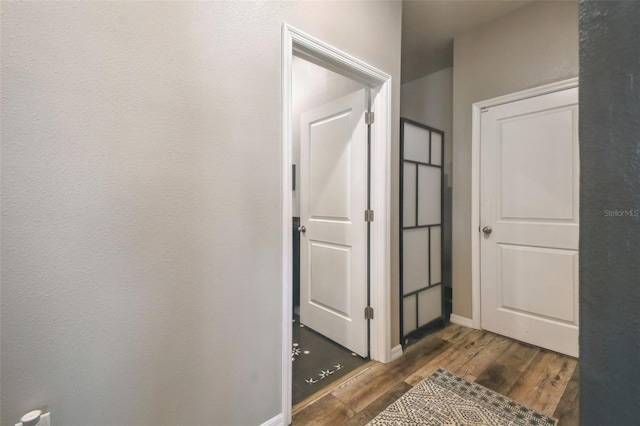 hall featuring dark wood-type flooring