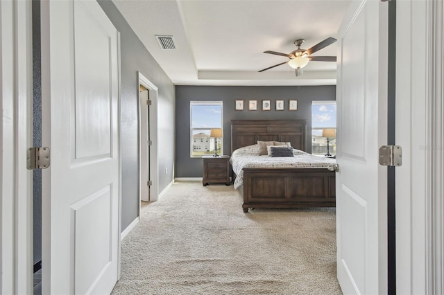 bedroom featuring light carpet and ceiling fan