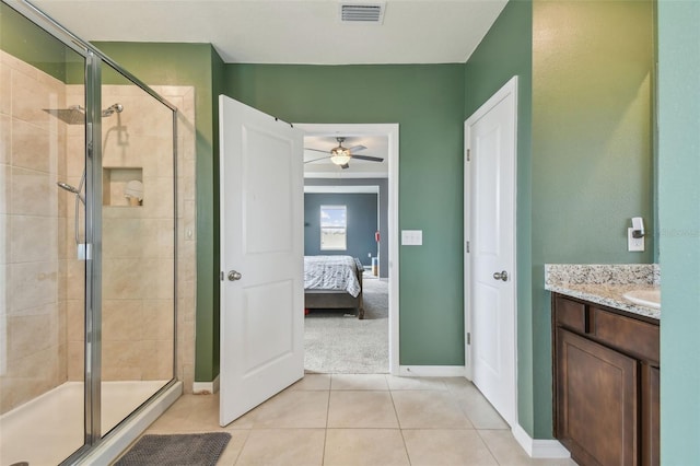 bathroom with an enclosed shower, vanity, tile patterned floors, and ceiling fan