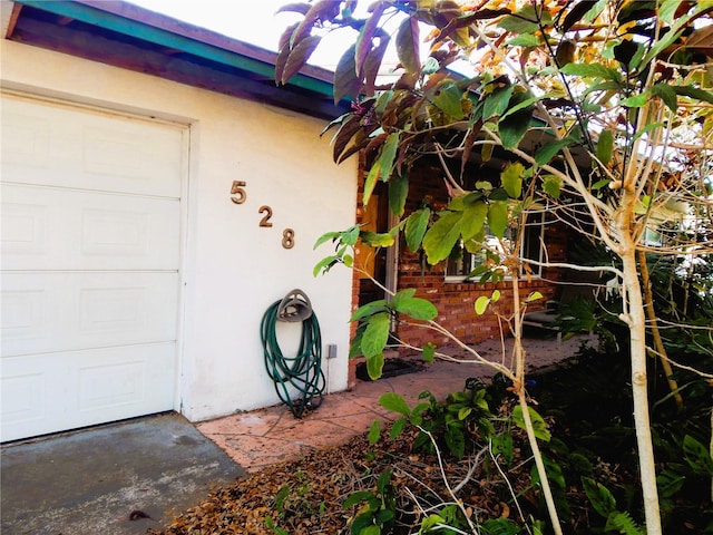 property entrance with a garage