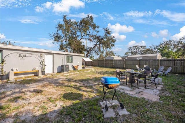 9169 Robin Rd, Seminole, FL 33777 - view of yard featuring a patio area and central air condition unit