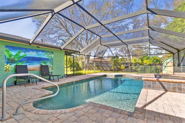 view of pool with a patio and glass enclosure