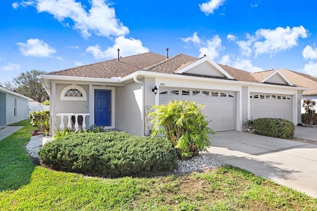 ranch-style home with a garage