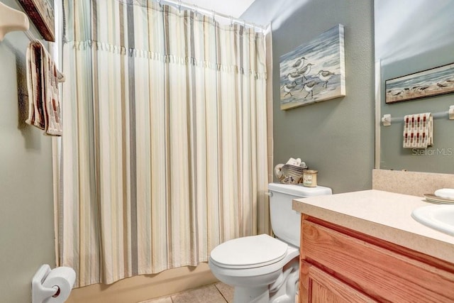 full bathroom with vanity, tile patterned floors, shower / bath combo with shower curtain, and toilet