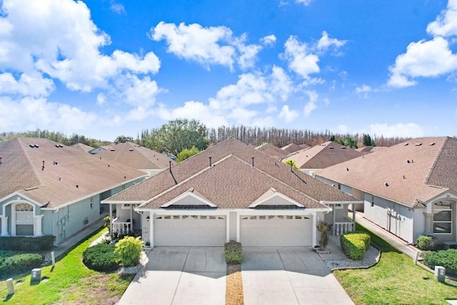 view of front of house with a garage and a front yard