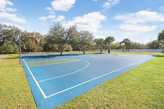 view of basketball court featuring a yard