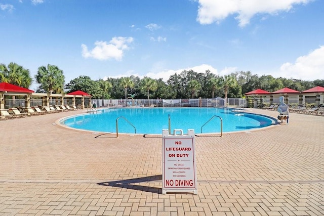 view of swimming pool featuring a patio