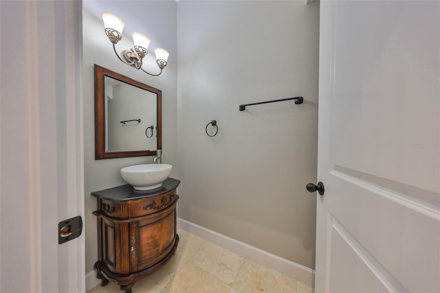 bathroom with tile patterned flooring, vanity, and baseboards