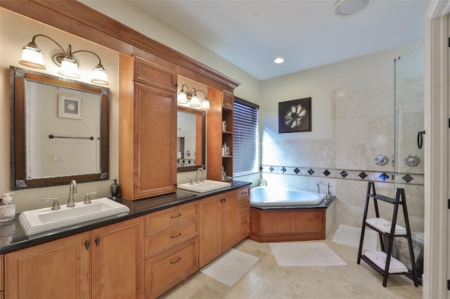 bathroom featuring a sink, a bath, a walk in shower, and double vanity