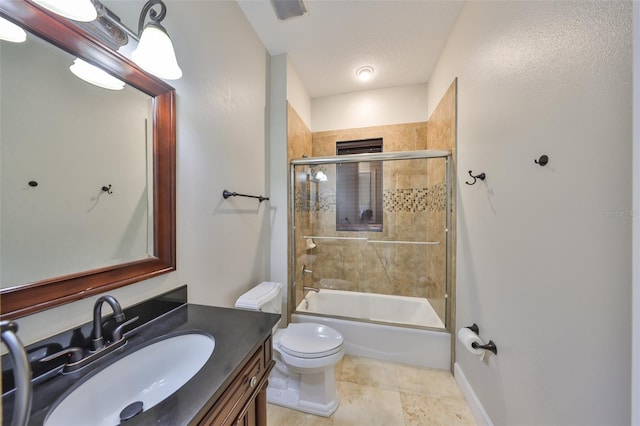 full bathroom featuring shower / bath combination with glass door, vanity, tile patterned floors, toilet, and visible vents