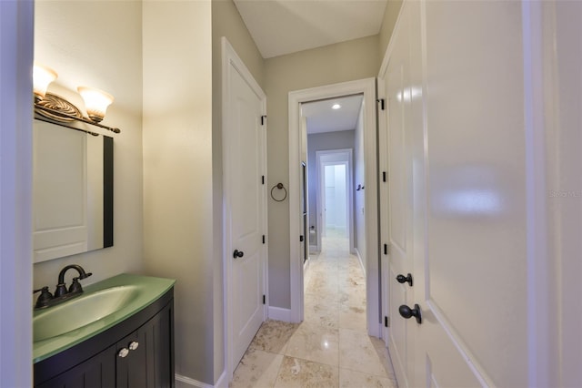 bathroom featuring vanity and baseboards