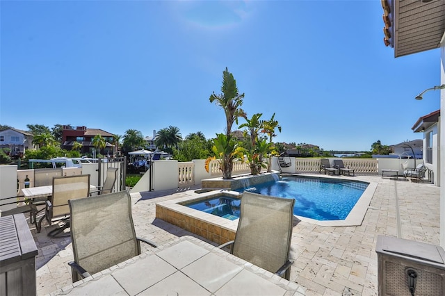 view of swimming pool featuring a patio area, a fenced backyard, outdoor dining area, an in ground hot tub, and a fenced in pool