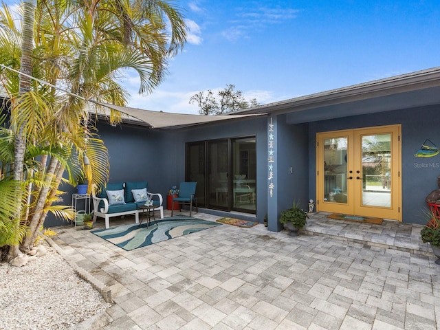 view of patio with outdoor lounge area and french doors