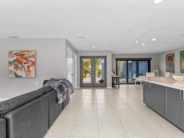 tiled living room featuring french doors