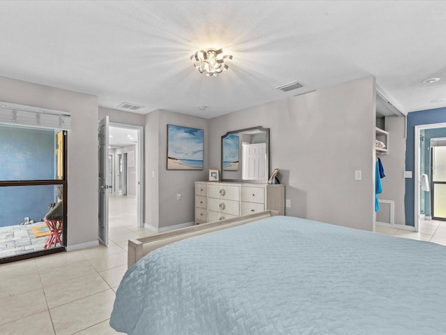 bedroom with light tile patterned floors