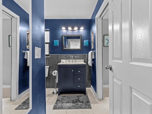 bathroom with tile patterned flooring and vanity