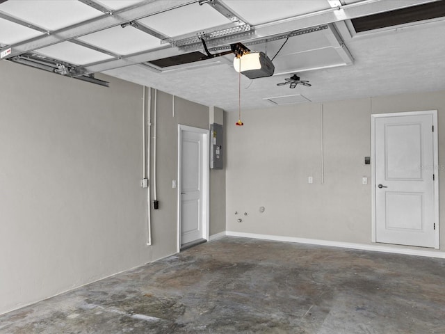 garage featuring a garage door opener and electric panel