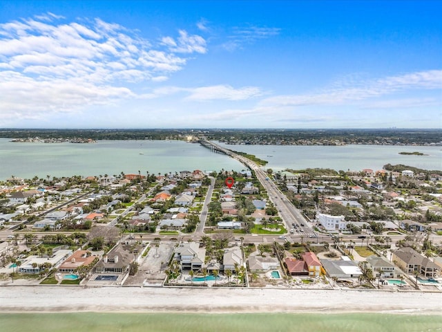 bird's eye view featuring a beach view and a water view