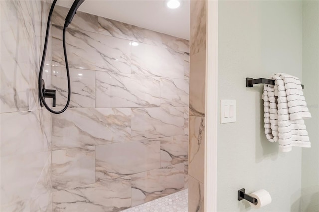 bathroom with tiled shower