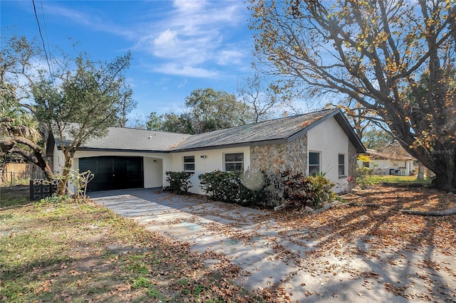 single story home with a garage