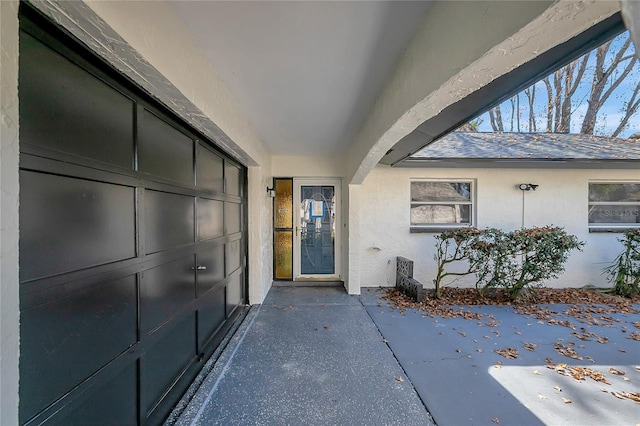 entrance to property featuring a garage