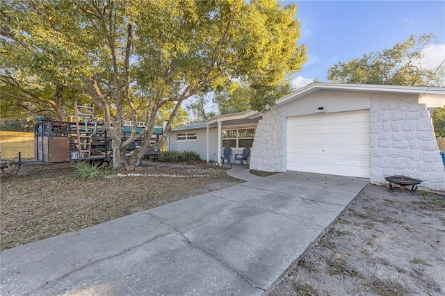 single story home with a garage