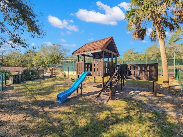 view of playground with a lawn