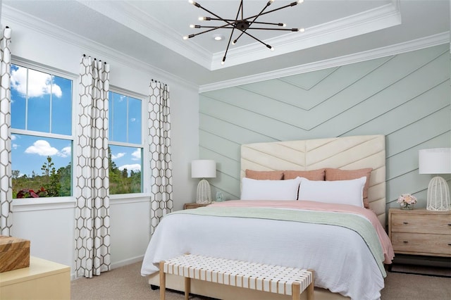 bedroom featuring crown molding, a raised ceiling, a chandelier, and carpet