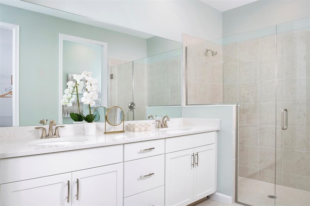 bathroom featuring vanity and an enclosed shower