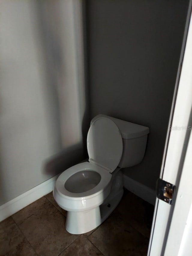 bathroom featuring tile patterned floors and toilet