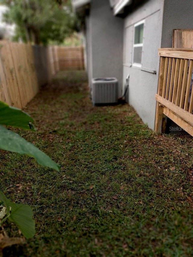 view of yard with central air condition unit