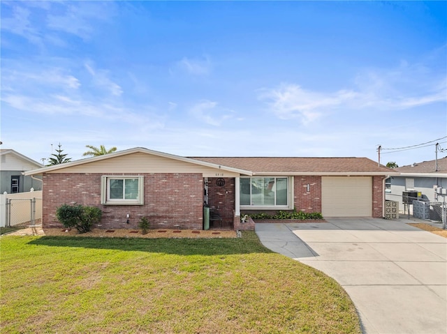 ranch-style home featuring a garage and a front yard