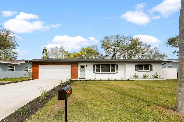 single story home featuring a garage and a front yard