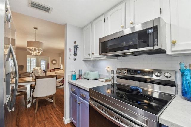 kitchen featuring a chandelier, visible vents, appliances with stainless steel finishes, and white cabinets