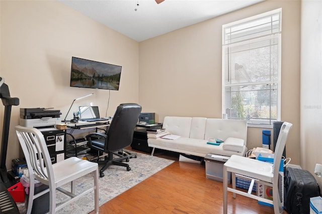 office area with hardwood / wood-style floors and ceiling fan